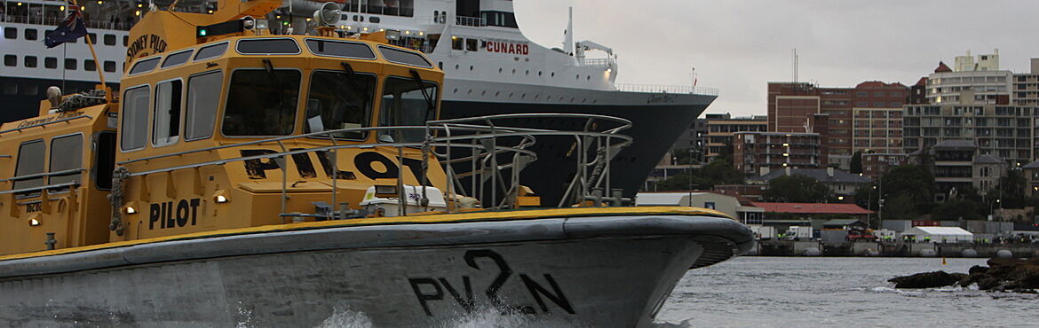 Yellow pilot cutter and ocean liner